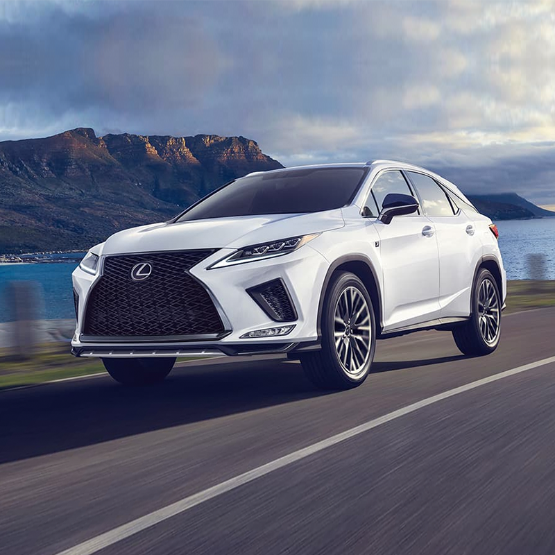 2020 Lexus RX driving down a scenic road
