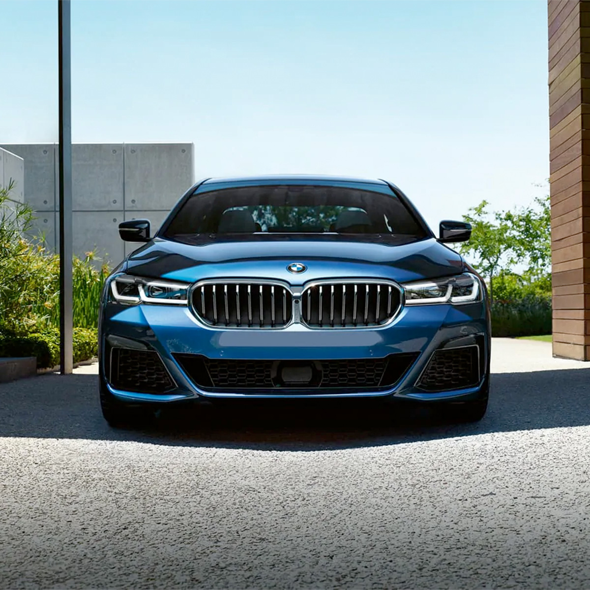 Front view of blue 2021 BMW 5 Series parked