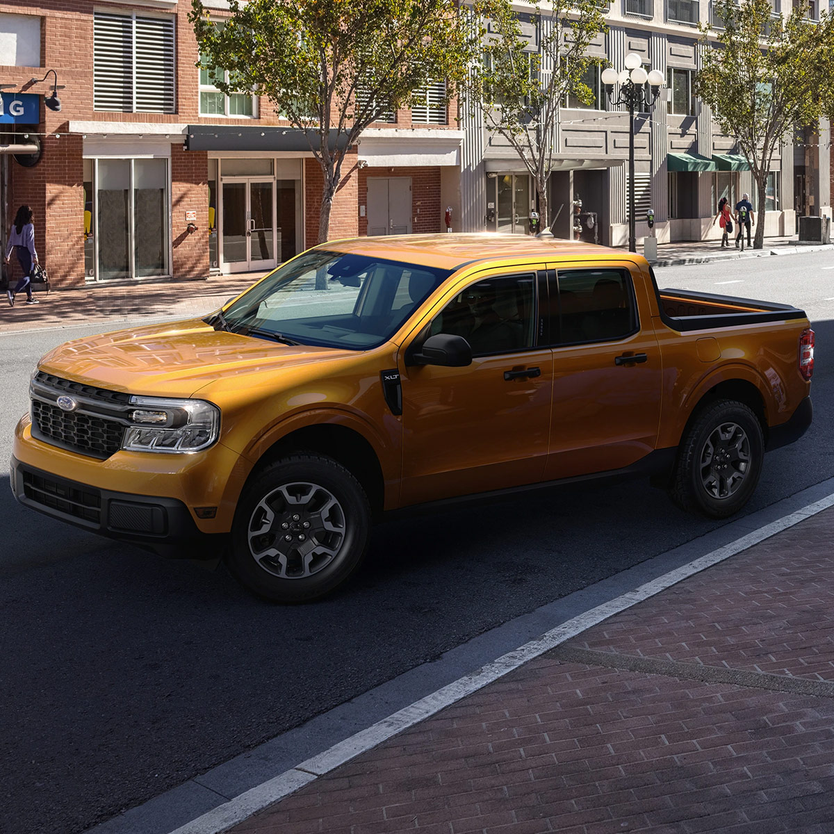 2022 Ford Maverick driving away from being parked on the street