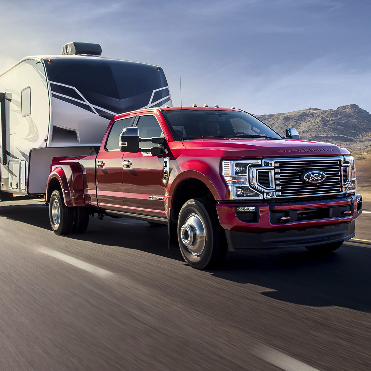 2022 Ford Super Duty hauling an RV on the highway